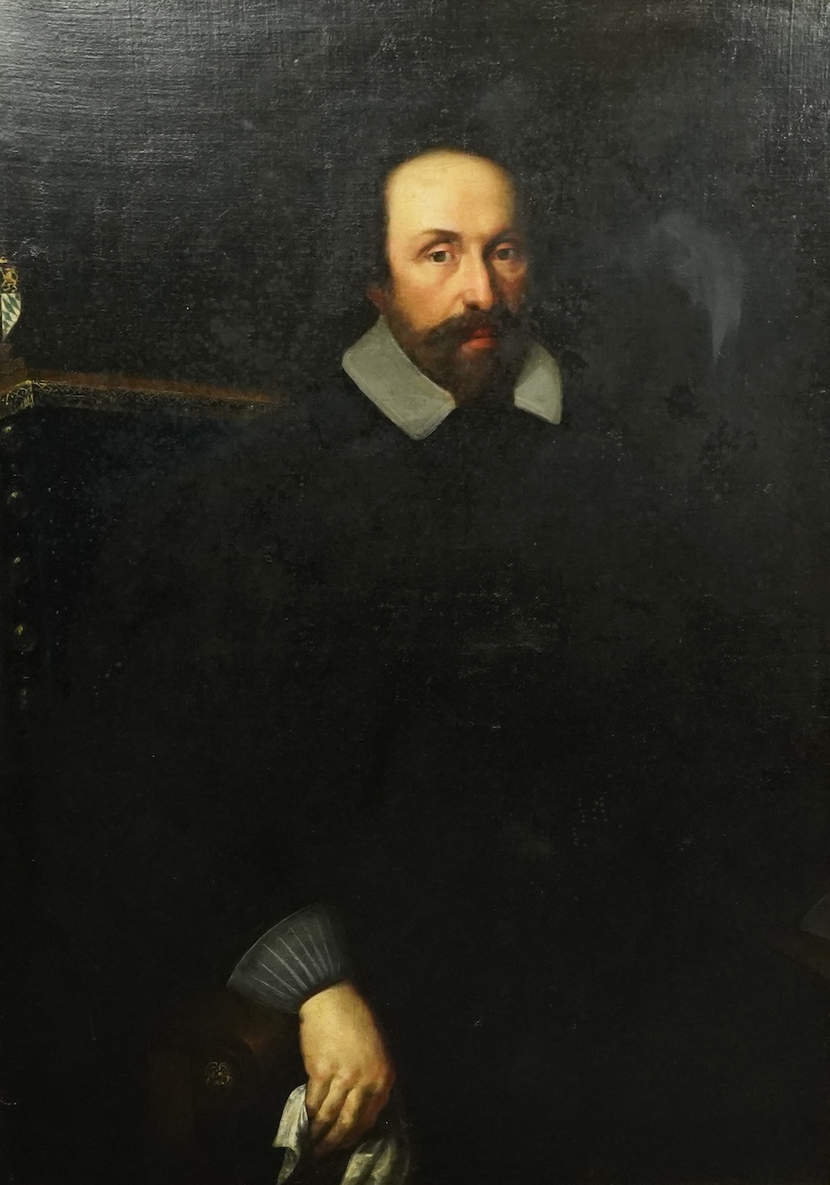 17th century Dutch School , Half length portrait of a seated gentleman, an armorial beyond, oil on canvas, 113 x 81cm